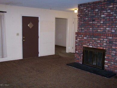 Living Room Fireplace and Front Door