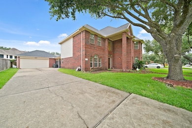 Driveway to the detached garage and gated side ent