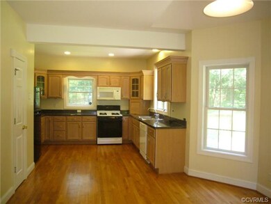 Eat in kitchen with pantry, door to deck
