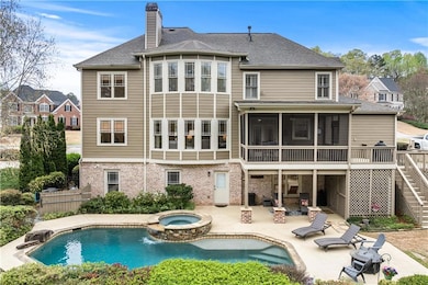 Back of property featuring a sunroom, fence, a chi