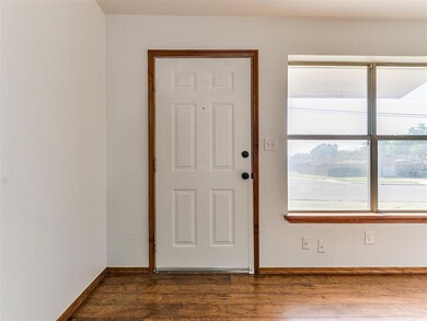 Foyer entrance with hardwood / wood-style floors