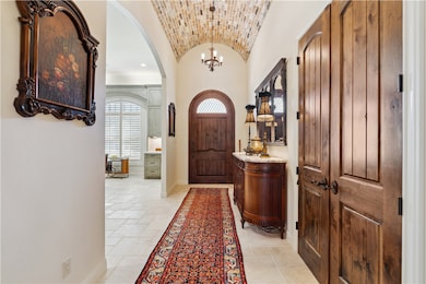  The topmost perimeter of the entry hall is clad i