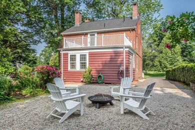 A view of the rear of the house. Can you spy the EV outlet? All of the modern day conveniences.