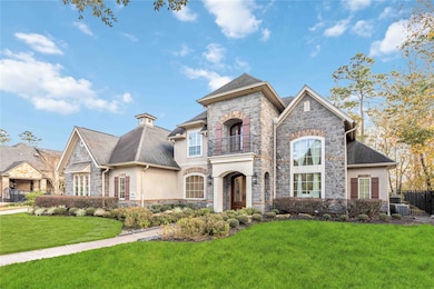 A beautiful, spacious two-story home with a stone