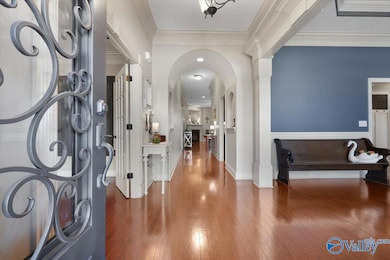 Pass thru the iron front door into the GORGEOUS foyer BURSTING WITH DETAILS!