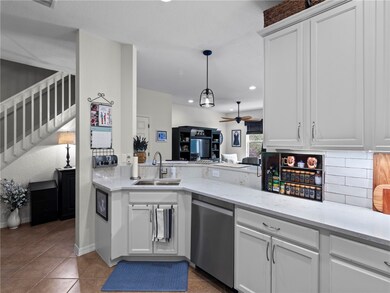 Kitchen has opening to dining and living areas