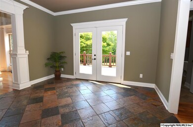 French doors lead to the deck. Slate tile flooring. 9' ceiling