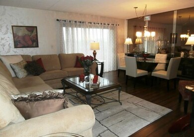 Living Room Gorgeous Hard Wood Floors throughout.