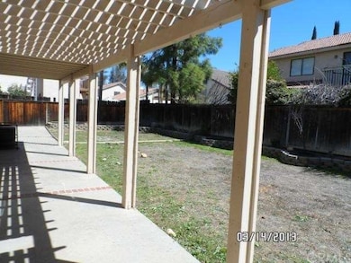 REAR COVERED PATIO/ BACK YARD