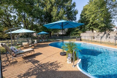 View of pool featuring a diving board and a patio 