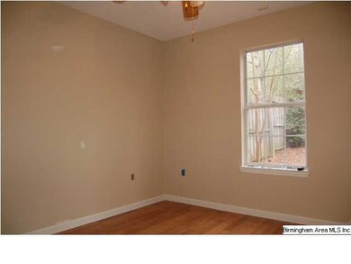 Guest bedroom with laminate flooring