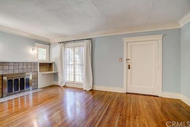 Front door into living room with gorgeous original