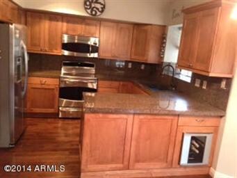 newly remodeled kitchen with granite cou