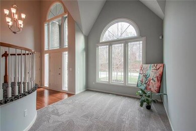 Formal living room at entry. House faces trees on 