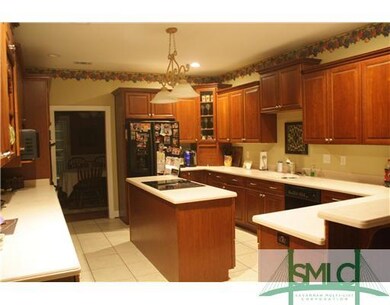 Kitchen. Kitchen has Island.  Refrigerator Remains