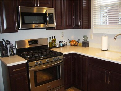 Redone kitchen, with hard surface counter top, new