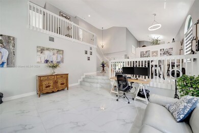 Very Bright Living room with steps leading to formal dining room