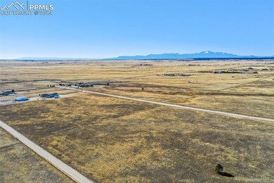 Birds eye view of property featuring a rural view 