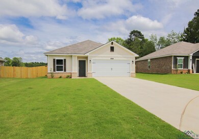 Ranch-style home with brick siding, driveway, a garage, and a shingled roof