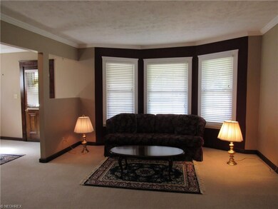 This view showcases the bay window with accent wal