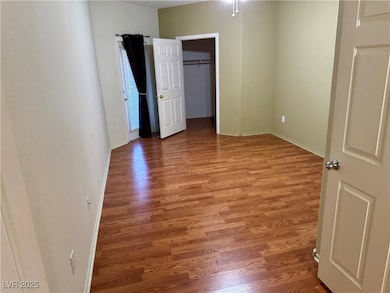 Unfurnished bedroom featuring light wood-style flo