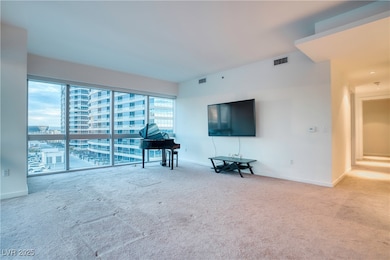 Living room with carpet floors and baseboards