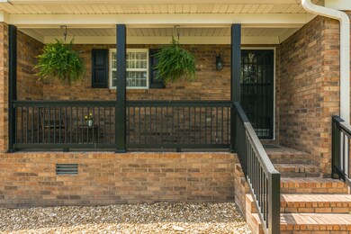 Bring your rocking chairs for this great front porch. 