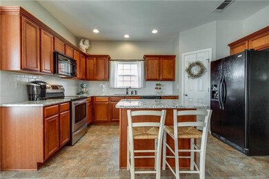 KITCHEN WITH ISLAND AND BUILT IN CABINETS