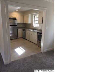 Kitchen is open to the living and dining area for 