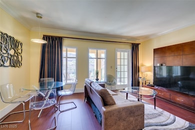 Living room featuring baseboards, dark wood-type f