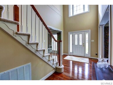 2-Story open Formal Foyer with Palladian window.