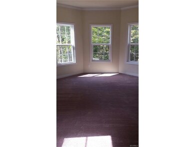 Master bedroom with bay window.