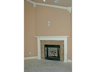 Living Room. A gas log fireplace creates a cozy fe