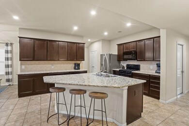 In this open concept design, the kitchen serves as the heart of the home, where meals are prepared, conversations flow, and memories are made.