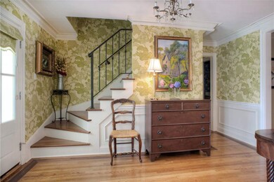 This ENTRY VIEW from your Front Door Looks right  into the Living Room and Dining Room, or through the DEN to the Private Rear Grounds!