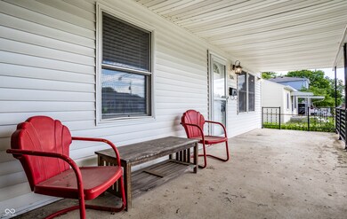 Kick back and relax on the covered front porch- and on a quiet street
