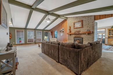 Huge Living Room with Wall of Windows, Beams and W