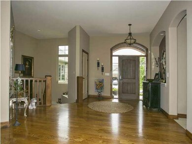 Entry foyer into open living room, dining room are