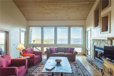 2-Story Great Room with HUGE Windows Showcase the Year-Round View