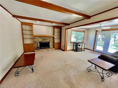 Large Family Room with gas fireplace overlooking p