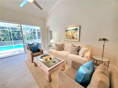 Living room with high vaulted ceiling, tile floori