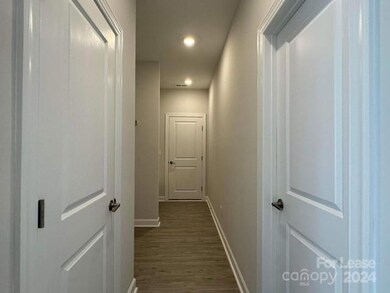 Hallway to garage, with entry bench bench includes usb phone outlets)