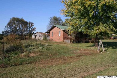 Land beside and behind the house is fenced.