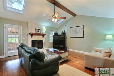 Open family room with vaulted ceiling and wood bur