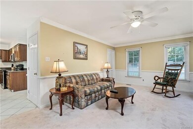 Living room finishes include neutral carpet, wains