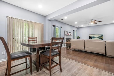 Dining space with a ceiling fan, visible vents, a 