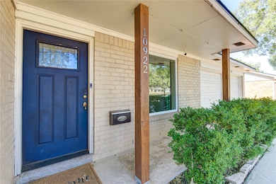 Beautiful, covered front porch with recent picture window.
