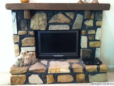 Stacked stone wood burning fireplace