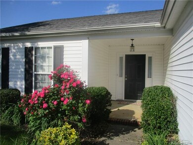 Inviting small covered porch.
