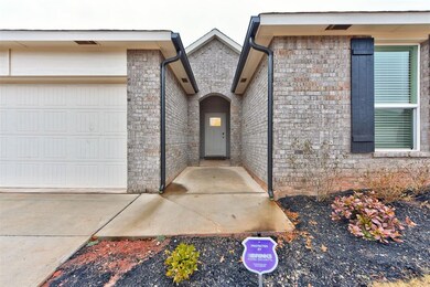 Doorway to property featuring a garage